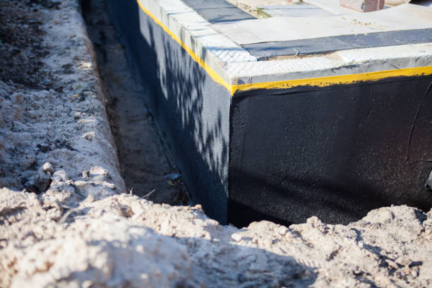 Professional Exterior Waterproofing technician working in Latham, KS